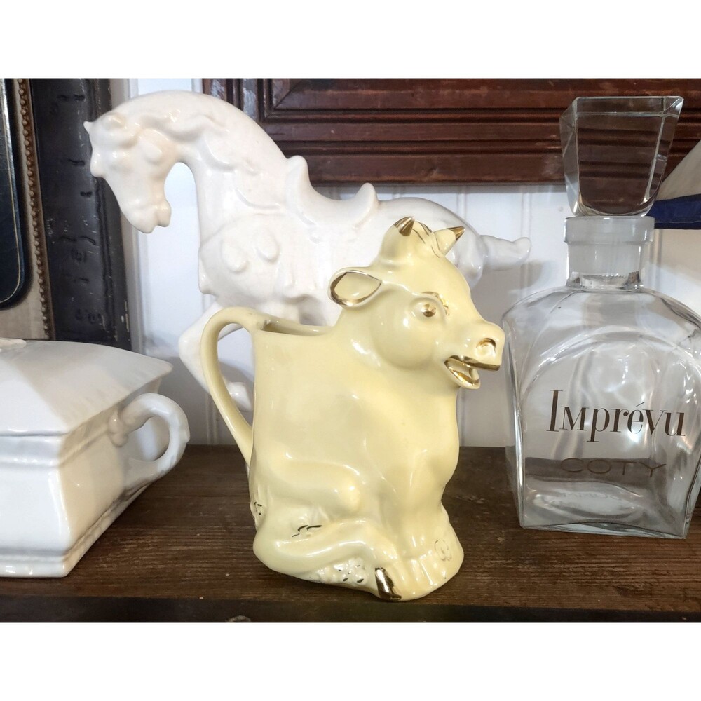 Pearl 635 Cow Creamer, trimmed with 22 kt gold, butter yellow color